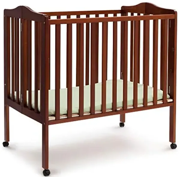 Delta Children Folding Portable Mini Baby Crib with 1.5-inch Mattress - Greenguard Gold Certified, Cherry