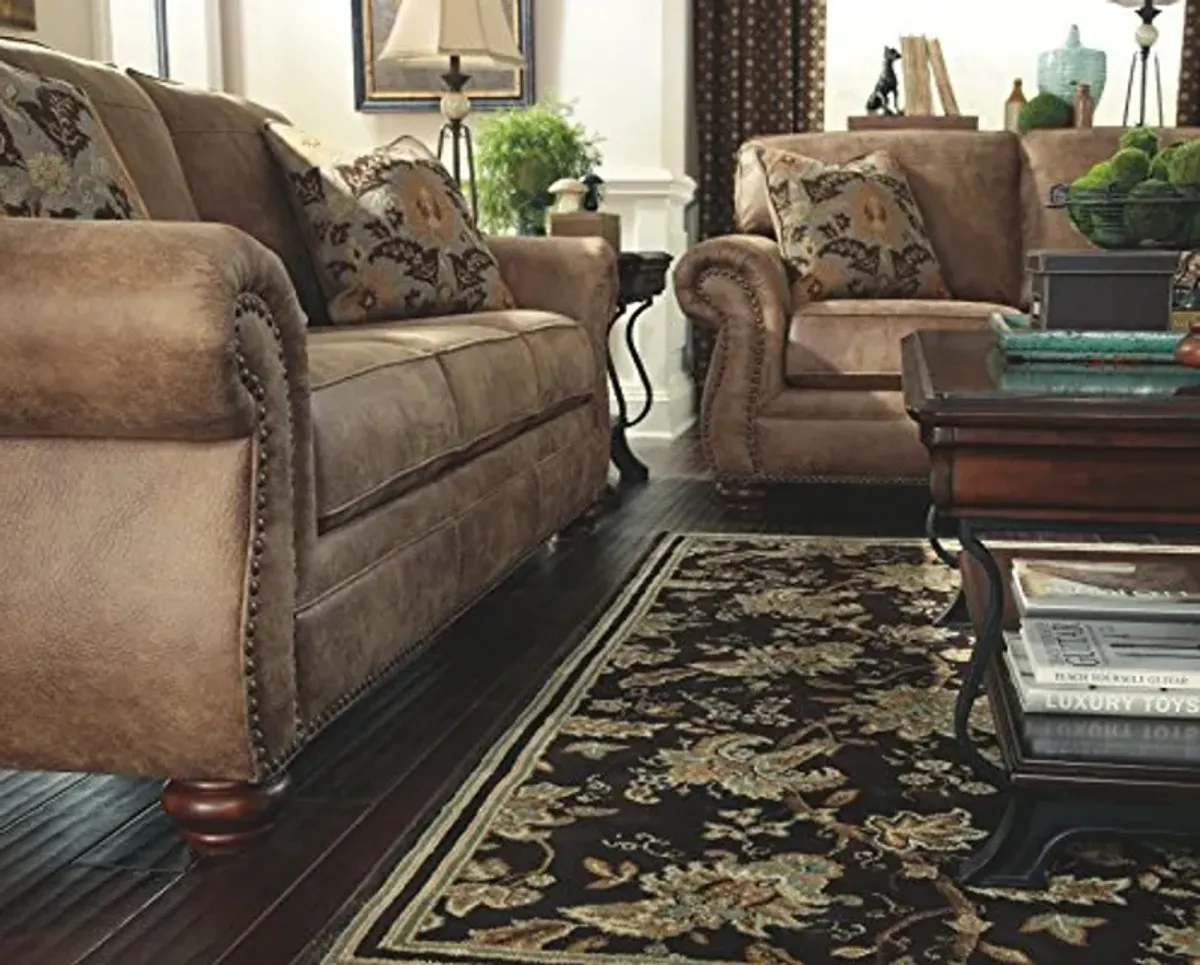 Signature Design by Ashley Larkinhurst Faux Leather Sofa with Nailhead Trim and 2 Accent Pillows, Brown