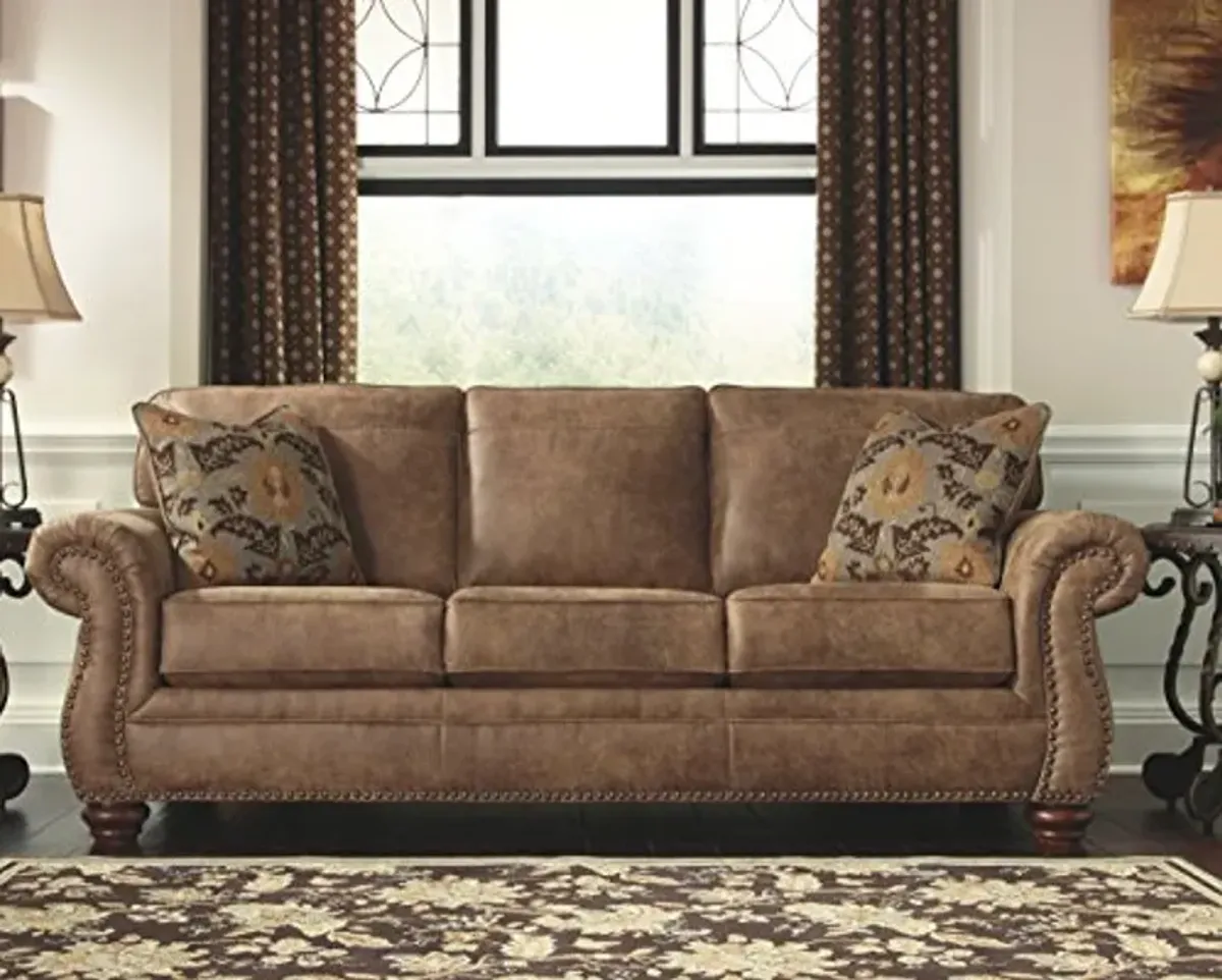 Signature Design by Ashley Larkinhurst Faux Leather Sofa with Nailhead Trim and 2 Accent Pillows, Brown