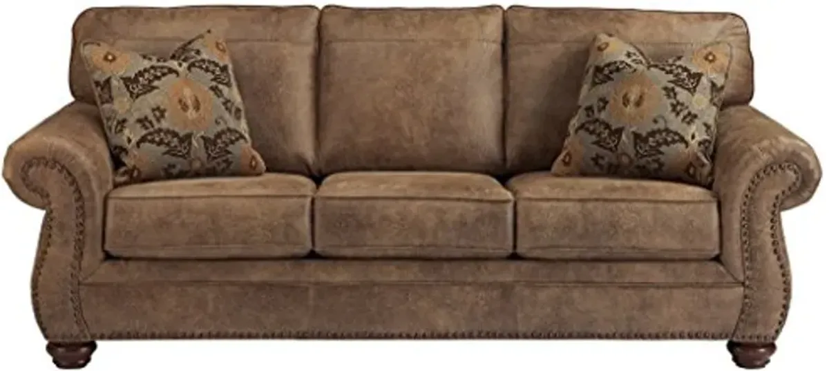 Signature Design by Ashley Larkinhurst Faux Leather Sofa with Nailhead Trim and 2 Accent Pillows, Brown