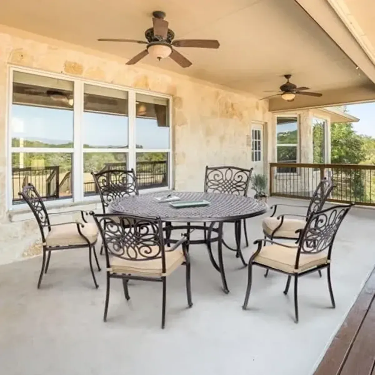 Hanover Traditions 7-Piece Outdoor Dining Set in Tan with Six Dining Chairs, Cushions and a 60 In. Round Cast-top Table, UV and Weather-Resistant, All-Weather Patio Dining Set for 6