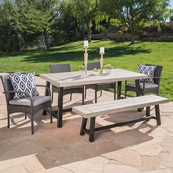 Christopher Knight Home Louise Outdoor Wicker Dining Set with Acacia Wood Table and Bench and Water Resistant Cushions, 6-Pcs Set, Sandblast Light Grey / Black Rustic Metal / Grey / Grey Cushions