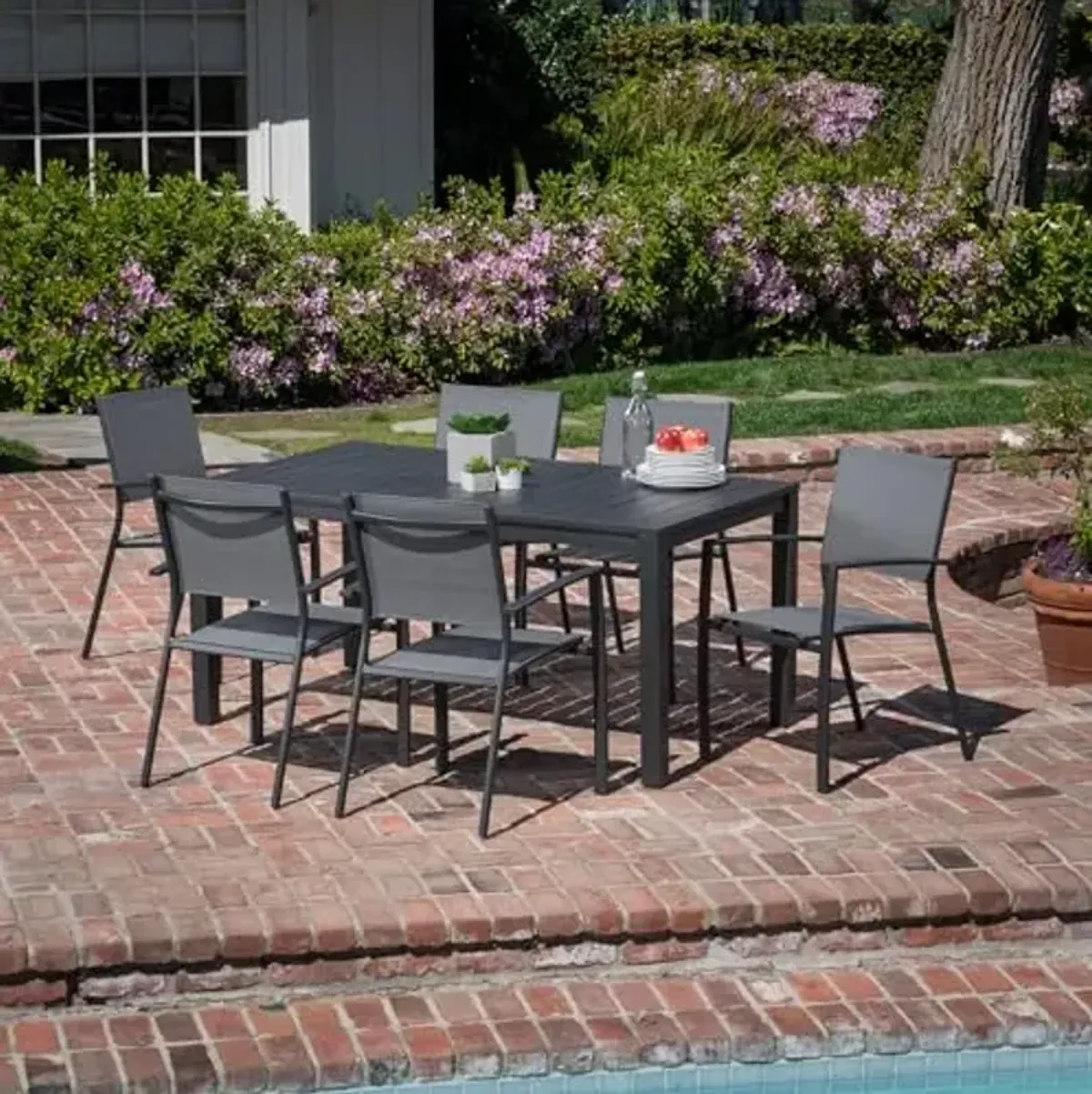Hanover Naples 7-Piece Outdoor Dining Set, Aluminum 63" x 35" Table with Stackable Sling Chairs, Modern, Comfortable, and Weather-Resistant Patio Dining Set for 6