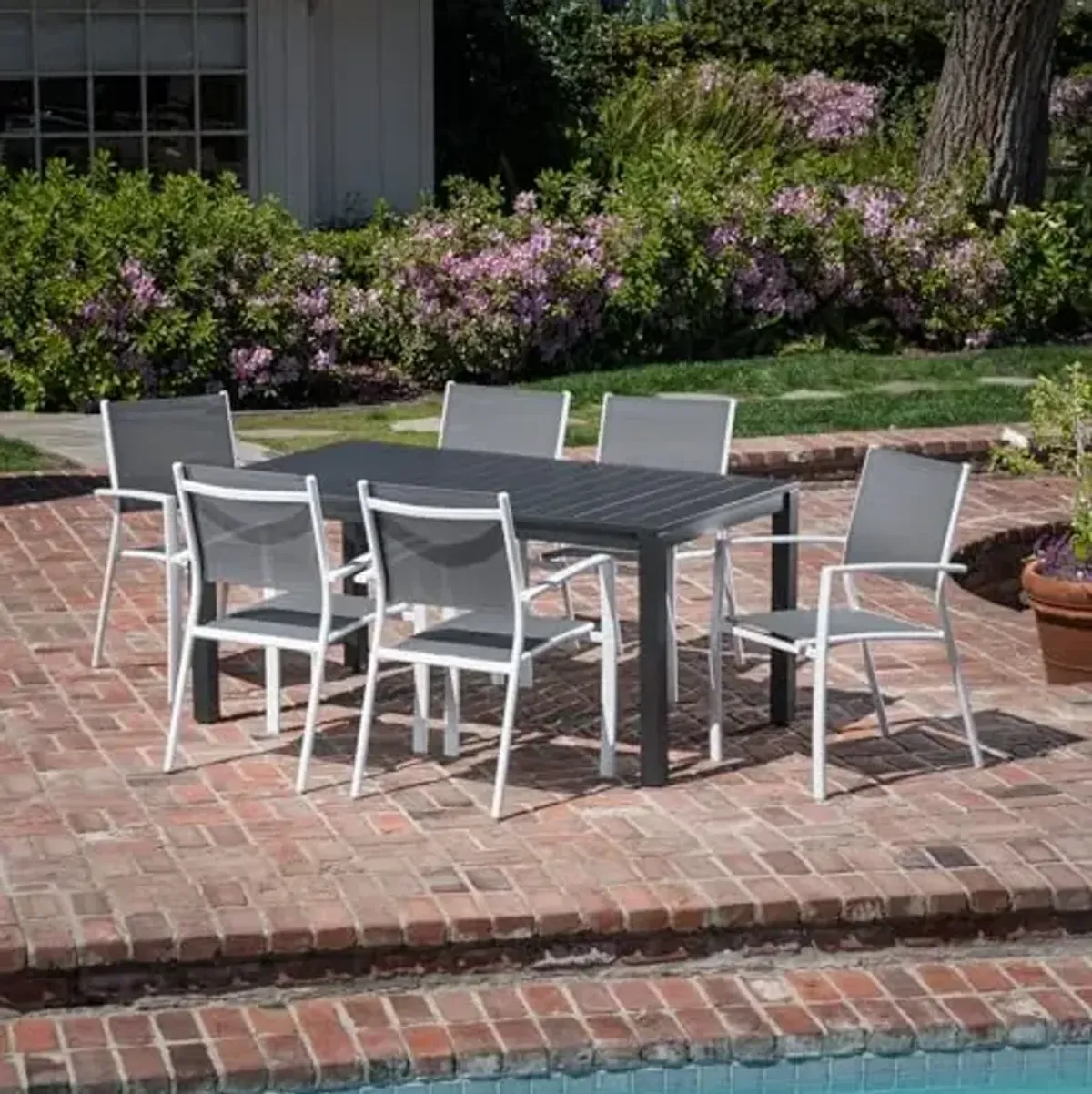 Hanover Naples 7-Piece Outdoor Dining Set, Aluminum 63" x 35" Patio Table with 6 Quick Drying Stackable Sling Chairs, Modern, Comfortable, and Weather-Resistant, White/Gray