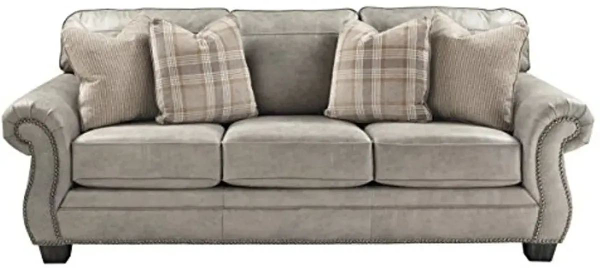 Signature Design by Ashley Olsberg Faux Leather Sofa with Nailhead Trim and 4 Accent Pillows, Gray