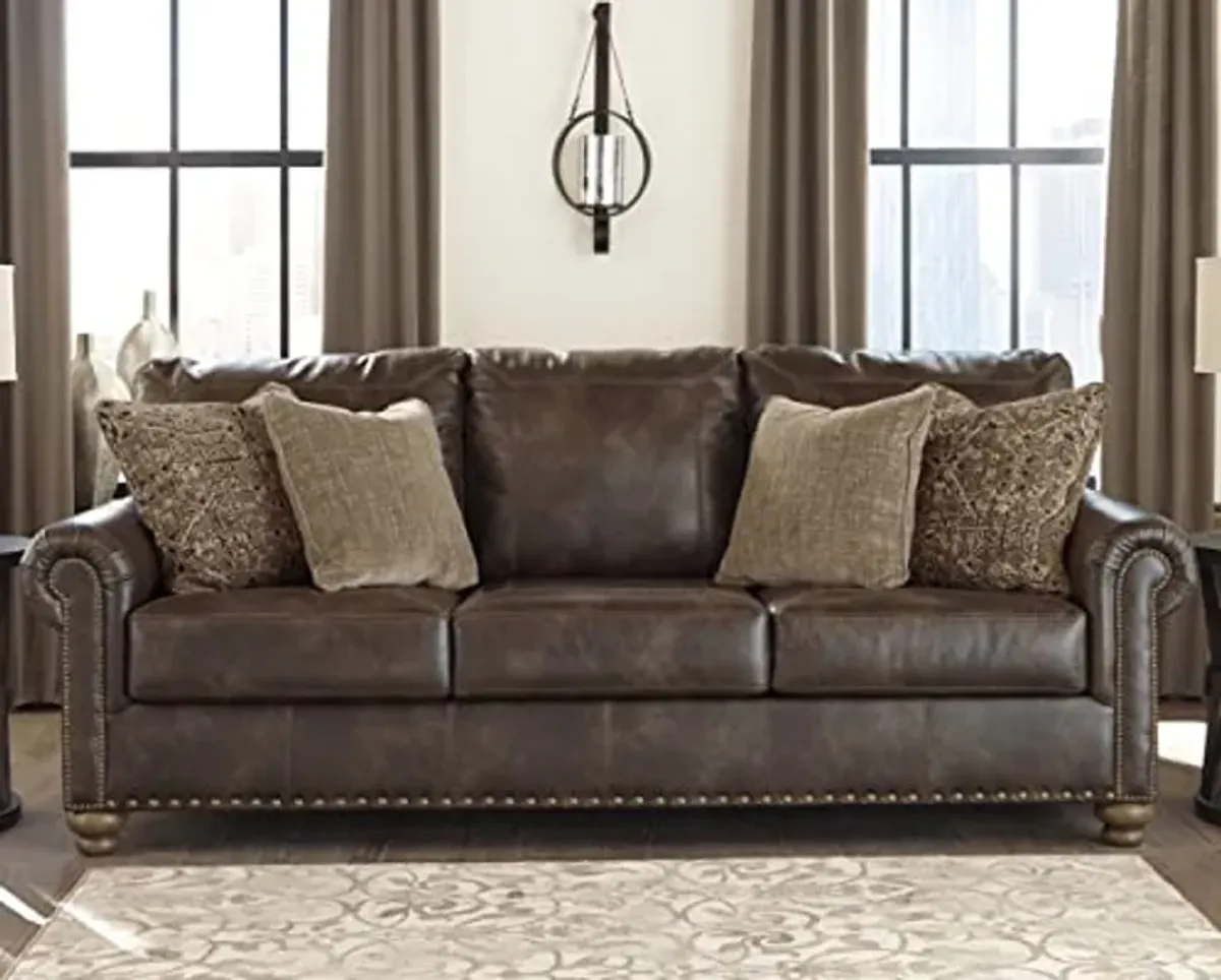 Signature Design by Ashley Nicorvo Traditional Faux Leather Sofa with Gold Nailhead Trim, Brown