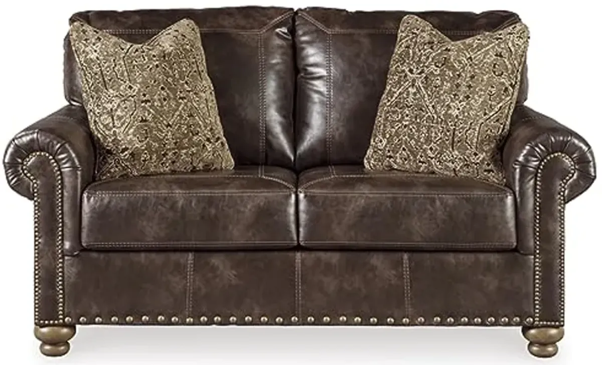 Signature Design by Ashley Nicorvo Vintagel Faux Leather Loveseat with Gold Nailhead Trim, Brown