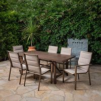 Hanover Fairhope 7-Piece Dining Set with 74-in. x 40-in. Trestle Table Outdoor Furniture, Tan