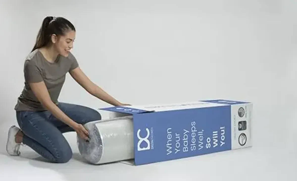 Delta Children Sweet Beginnings Dual Sided Crib and Toddler Mattress in a Box - GREENGUARD Gold and CertiPUR-US Certified - Plant-Based Soy Foam Core - Waterproof - 5 Year Warranty - Made in USA