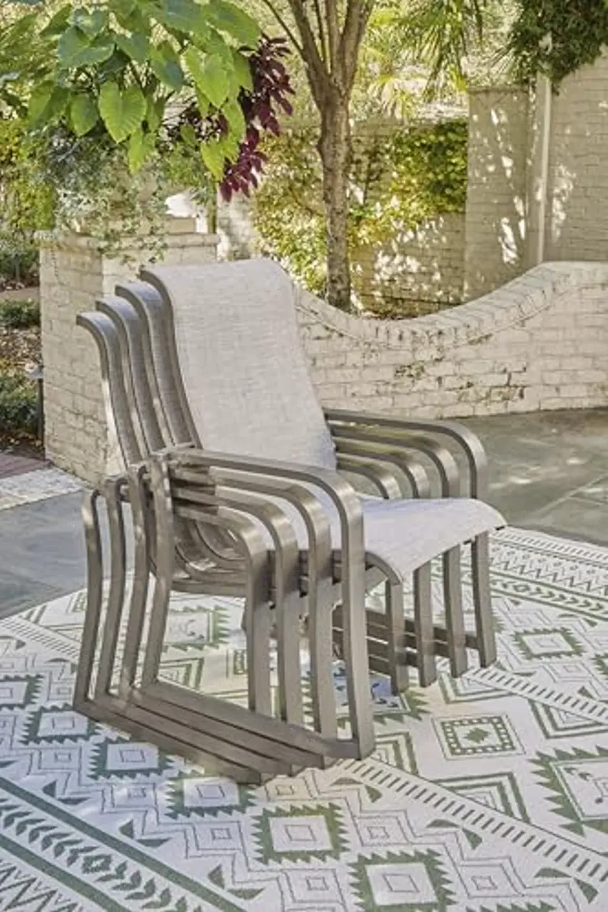 Signature Design by Ashley Beach Front Casual Outdoor Stackable Faux Leather Sling Arm Chair, Set of 4, Light Brown