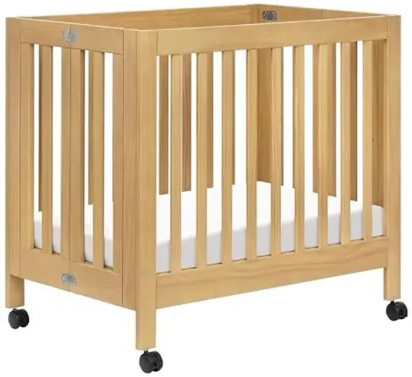 Babyletto Origami Mini Crib with Wheels - GREENGUARD Gold Certified - Portable Baby Crib for Small Spaces - Foldable & Converts to Twin Bed - Easy Setup - 2 Adjustable Mattress Positions - Honey