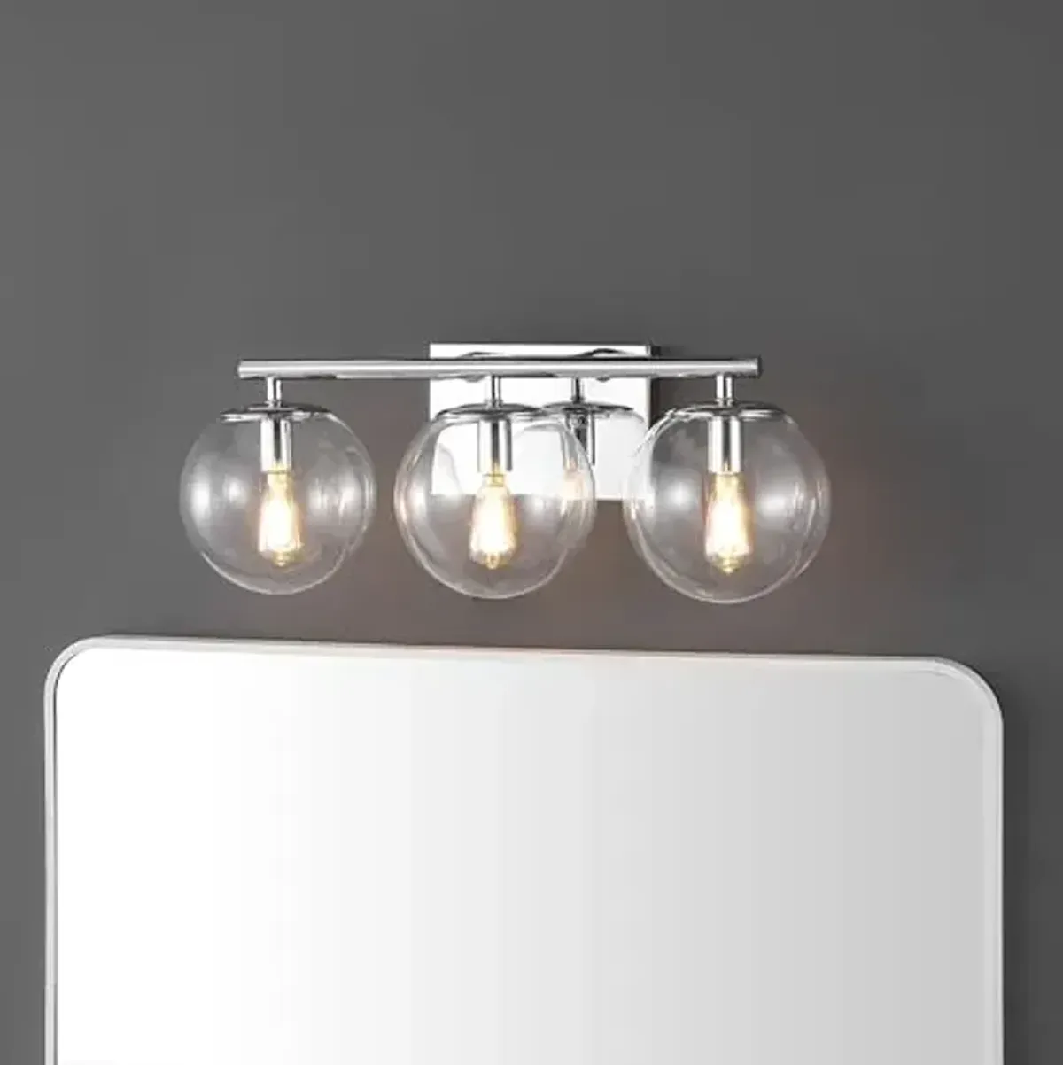 SAFAVIEH Lighting Collection Charlene Chrome/Clear Glass Globe Shade 3-Light Wall Sconce Light Fixture, Ideal for Bathroom, Entryway, Vanity Over Mirror, Foyer, Living Room (LED Bulbs Included)