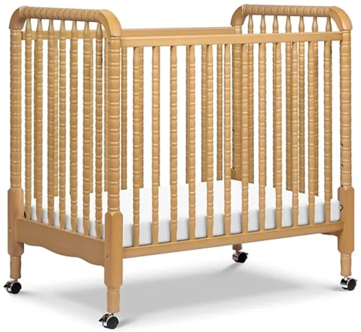 DaVinci Jenny Lind 3-in-1 Convertible Mini Crib in Honey, Removable Wheels, Greenguard Gold Certified