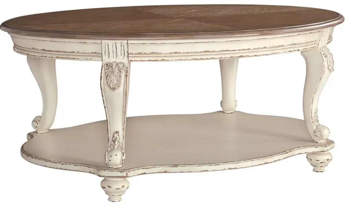 Realyn - White / Brown - Oval Cocktail Table