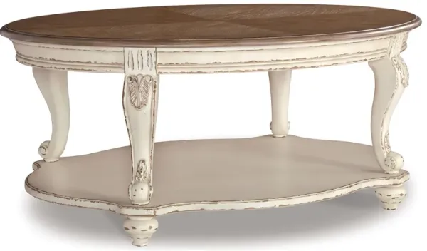 Realyn - White / Brown - Oval Cocktail Table