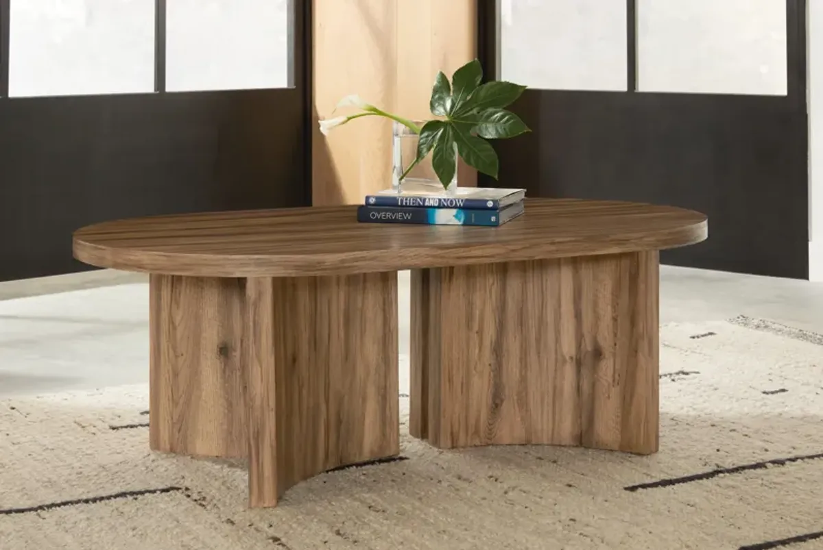 Austanny - Warm Brown - Oval Cocktail Table