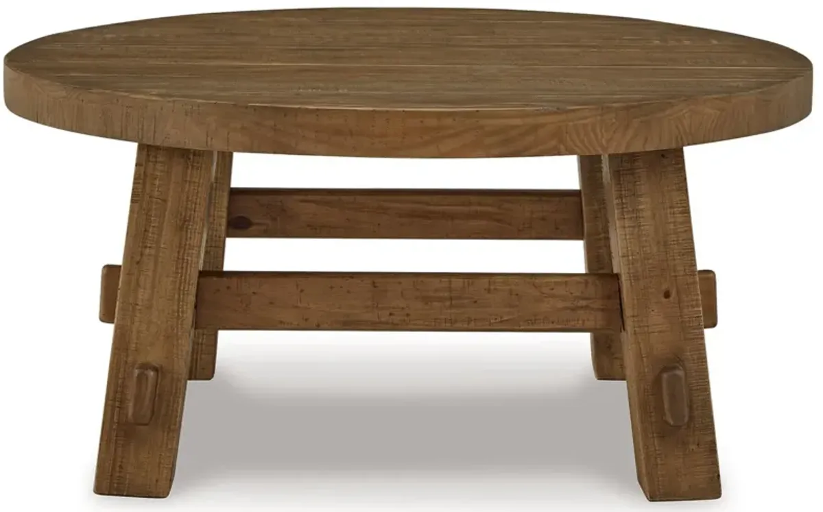 Mackifeld - Round Cocktail Table - Warm Brown