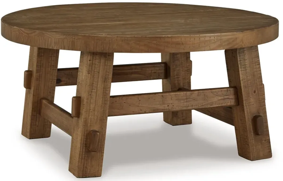 Mackifeld - Round Cocktail Table - Warm Brown