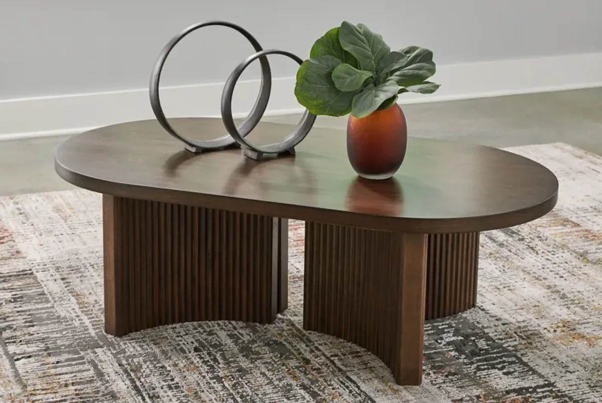 Korestone - Dark Brown - Oval Cocktail Table