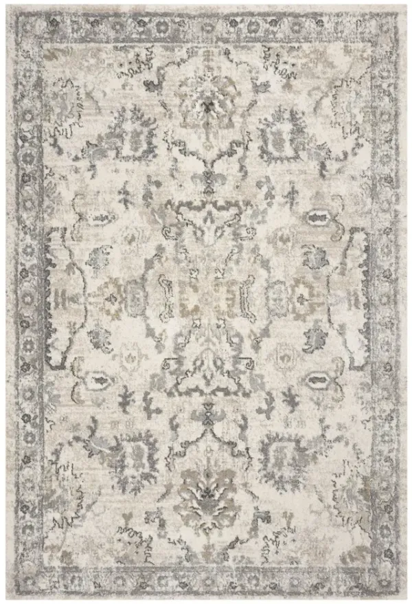 9' x 13' Machine Woven Distressed Floral Traditional Indoor Area Rug - Ivory