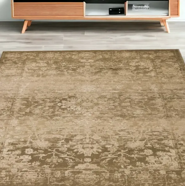 5' x 8' Machine Woven Distressed Floral Traditional Indoor Area Rug - Beige