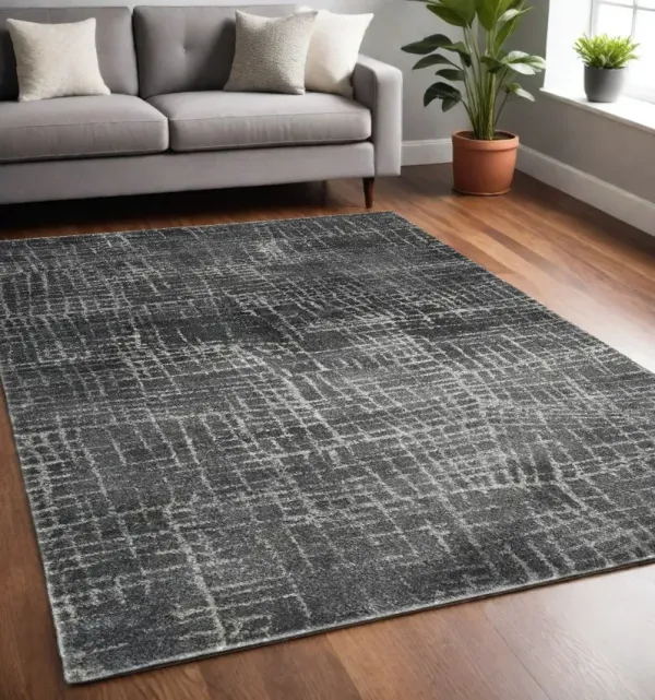 5' x 8' Machine Woven Abstract Scratch Indoor Area Rug - Gray