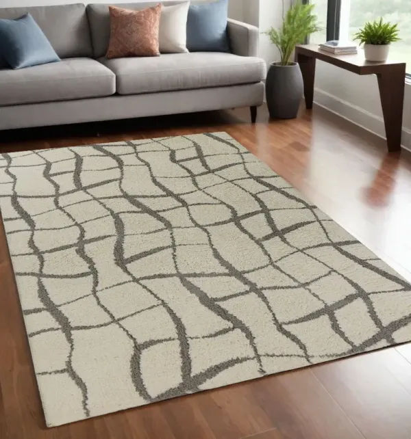 5' x 7' Machine Woven Abstract Indoor Shag Rug - Ivory