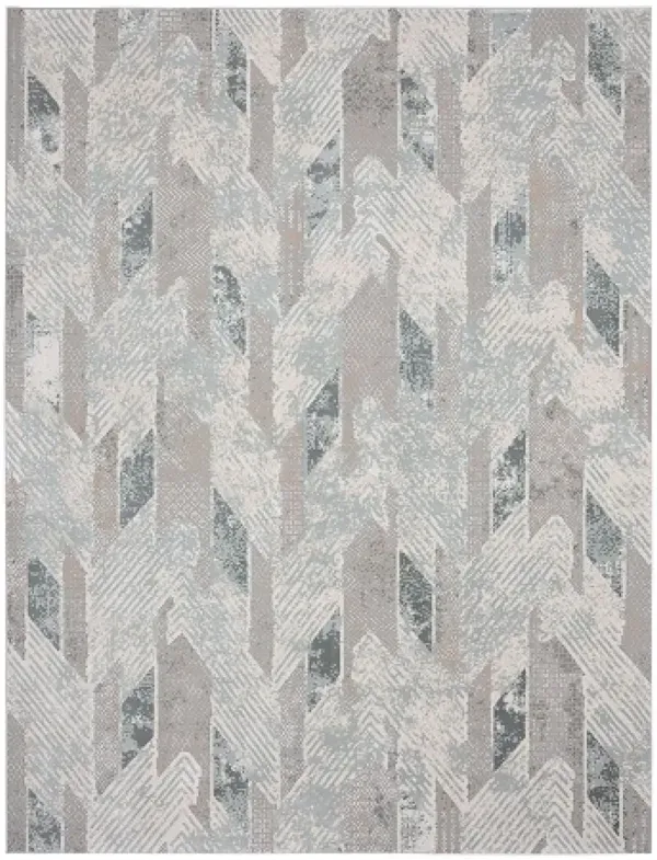 9' x 12' Geometric Distressed Stain Resistant Area Rug - Gray Blue And Cream