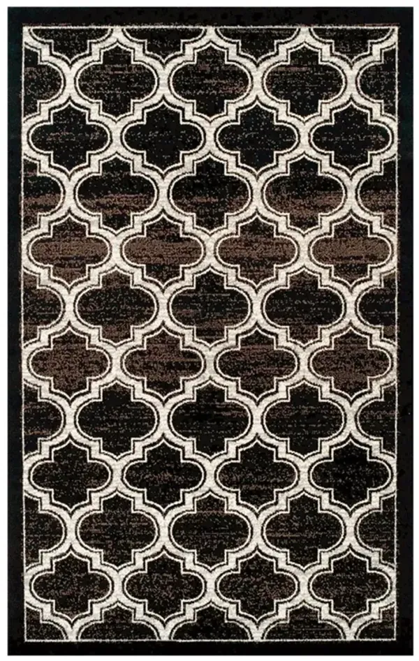 5' x 8' Geometric Stain Resistant Area Rug - Black