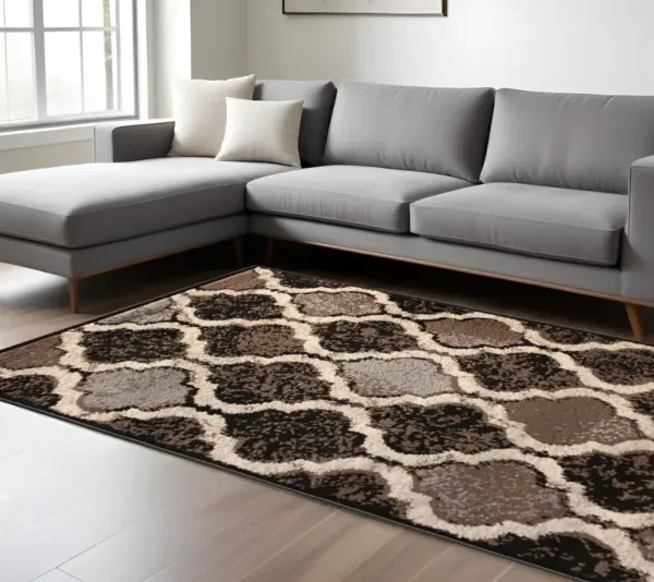 7' x 9' Quatrefoil Power Loom Distressed Stain Resistant Area Rug - Chocolate