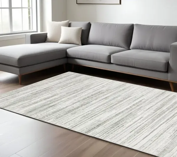 6.6' x 9.7' Abstract Power Loom Area Rug - Gray And White