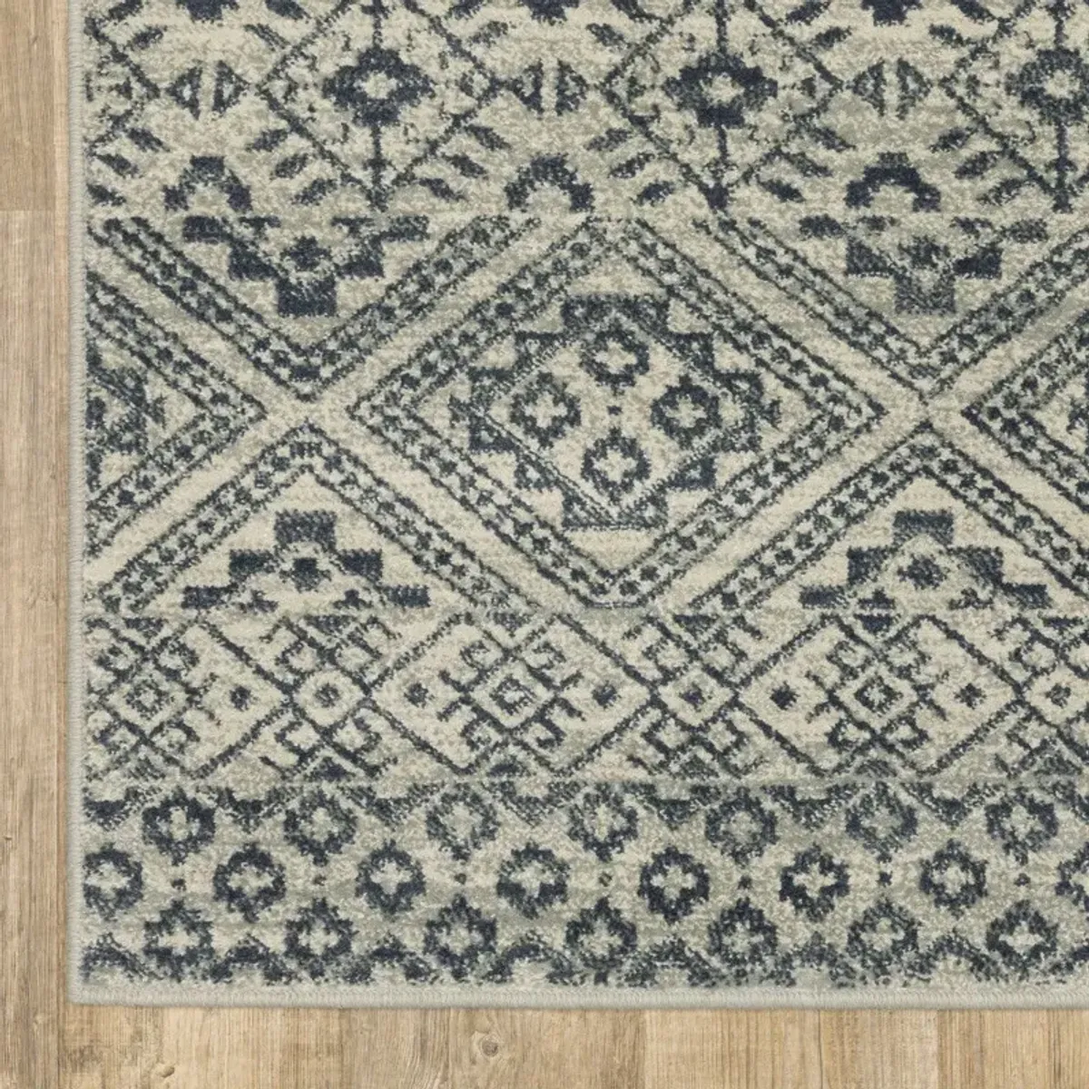 6' x 9' Geometric Power Loom Stain Resistant Area Rug - Blue And Beige