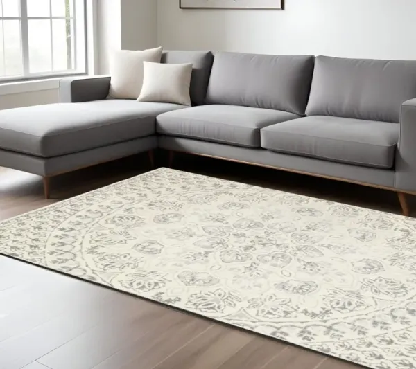 8' x 11' Floral Power Loom Stain Resistant Area Rug - Ivory And Gray