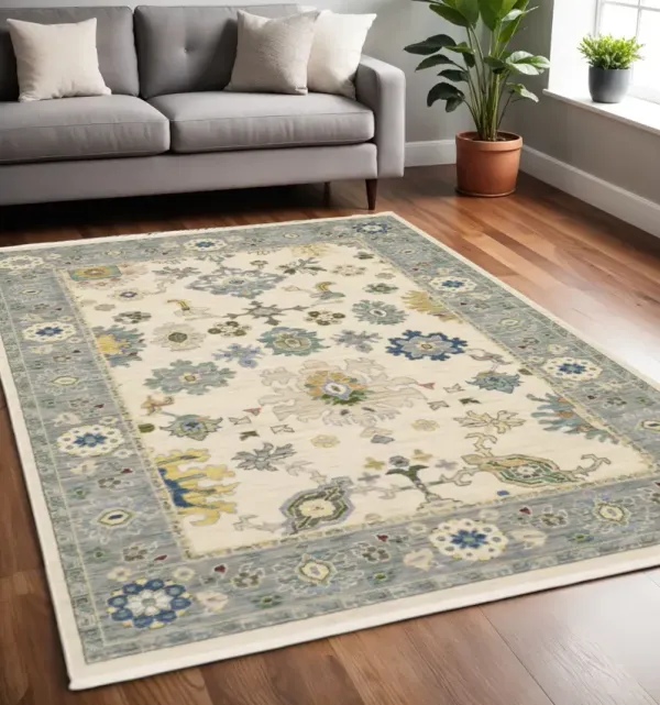 5' x 8' Oriental Power Loom Stain Resistant Area Rug With Fringe - Ivory Blue Gray Teal Gold Green And Rust