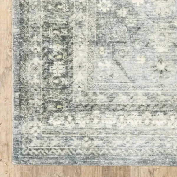 5' x 7' Oriental Power Loom Stain Resistant Area Rug - Blue Ivory And Gray