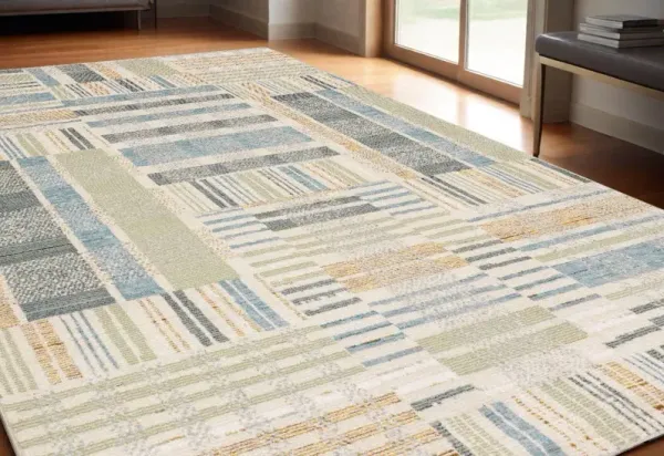 5.3' x 7.6' Geometric Power Loom Area Rug - Gray And Ivory