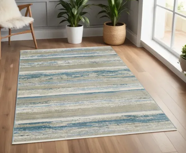 4' x 6' Abstract Power Loom Stain Resistant Area Rug With Fringe - Ivory Beige Gray Blue And Tan