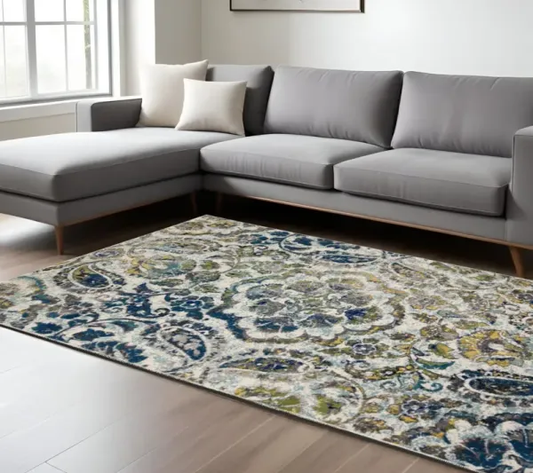 7' x 10' Floral Stain Resistant Area Rug - Ivory Blue And Green