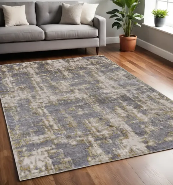 5' x 8' Abstract Stain Resistant Area Rug - Gray And Gold