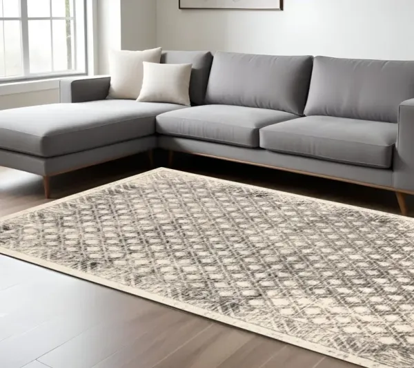 7' x 10' Abstract Stain Resistant Area Rug - Ivory Black And Taupe