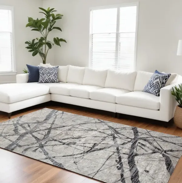 7' x 10' Abstract Stain Resistant Area Rug - Taupe Gray And Ivory