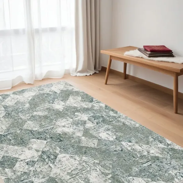 5' x 8' Patchwork Distressed Stain Resistant Area Rug - Green And Ivory