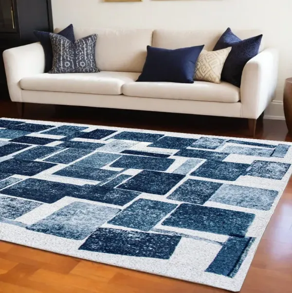 7' x 9' Geometric Non Skid Area Rug - Blue And White