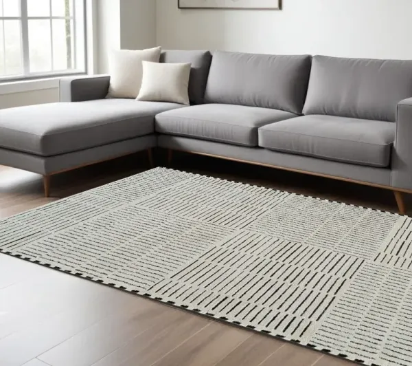 7' x 10' Modern Abstract Distressed Polypropylene Area Rug - Cream And Black