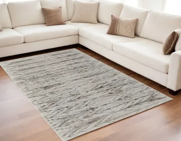 5' x 8' Geometric Power Loom Area Rug - Ivory And Brown