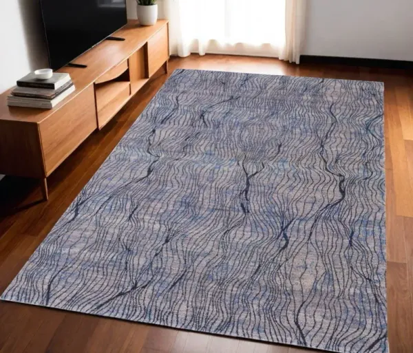5' x 8' Abstract Power Loom Washable Area Rug - Blue Pink And Tan