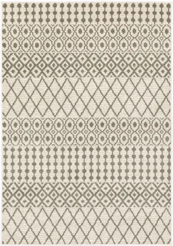 5' x 7' Geometric Power Loom Stain Resistant Area Rug - Ivory And Gray
