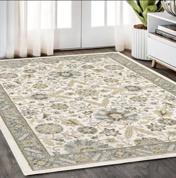 5.3' x 7.6' Oriental Power Loom Area Rug - Ivory And Gray