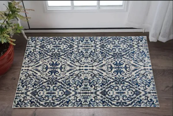 2' x 4' Floral Distressed Stain Resistant Area Rug - Blue Ivory And Black