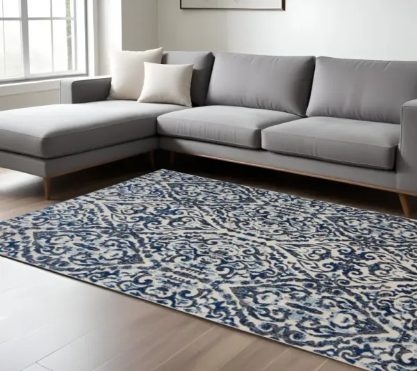 7' x 10' Floral Distressed Stain Resistant Area Rug - Blue Ivory And Black
